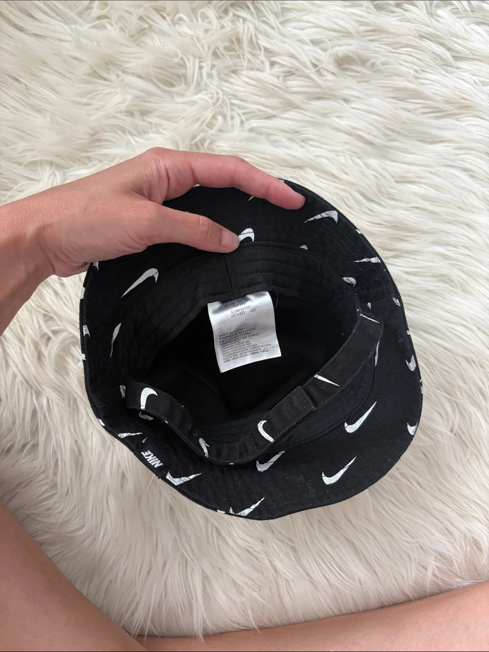 Nike Black Bucket Hat with White Swoosh Pattern - infant